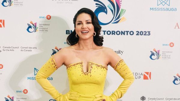 Sunny Leone Radiates Glamour In A Stunning Yellow Strapless Gown At IFFSA Red Carpet