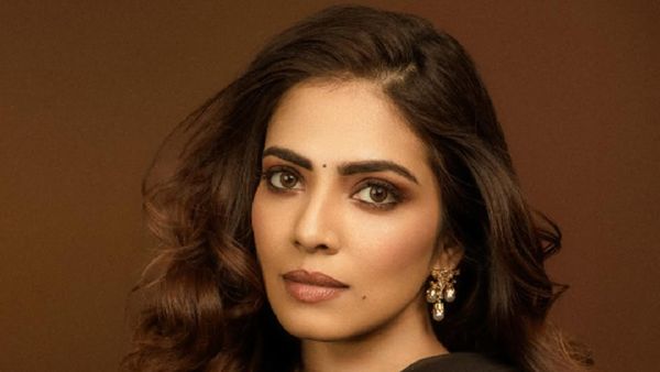 Malavika Mohanan Outshines Everyone In Regal Ensemble At The Raja Saab Pre Release Event