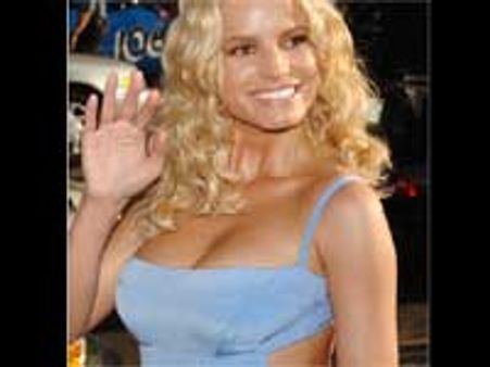 அமெரிக்க பாப் பாடகி ஜெஸிகா சிம்ப்சனுடன் உட்ஸுக்குத் தொடர்பு?