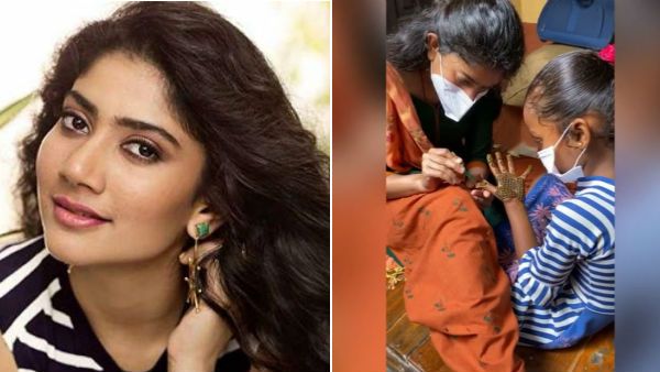 இதெப்படி இருக்கு..? மெஹந்தி டிசைனராக மாறிய நம்ம 'ரவுடி பேபி'.. மகிழ்ச்சியில் குழந்தைகள்!