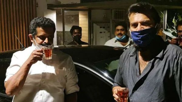 கொரோனா.. 275 நாளுக்குப் பின் வீட்டைவிட்டு வெளியே வந்த பிரபல ஹீரோ.. கட்டன் சாயாவுடன் போஸ்!