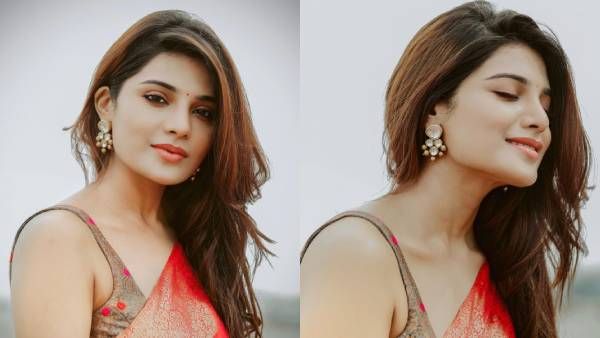 செழித்த அழகில் சிவந்து நிற்கும் செந்தேனே... சேலையில் வருடும் ஆத்மிகா!