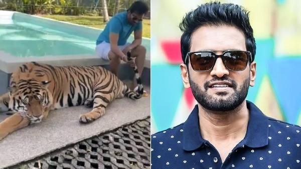 புலி வாலை பிடித்த சந்தானம்.டேய்.. கைய வச்சிகிட்டு சும்மா இருப்பா.. கிண்டலடிக்கும் நெட்டிசன்ஸ்!