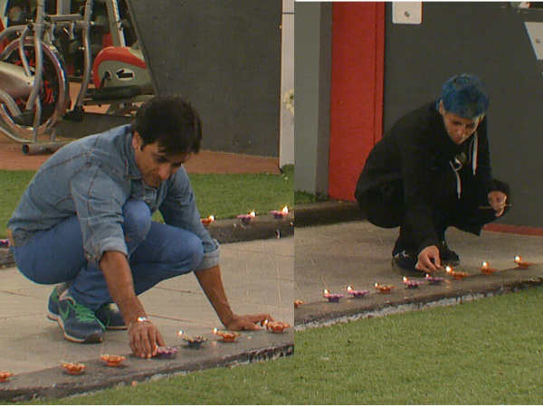 Housemates lighting up diyas