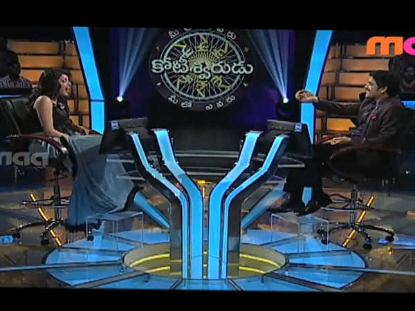 Kajal Seated Opposite Nagarjuna