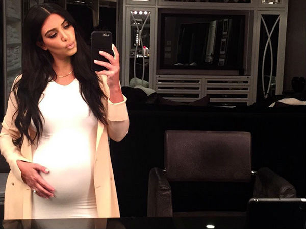 Kim Kardashian West Goes Naked To Show Her Baby Bump & Slam Haters Kim Kardashian West Goes Naked To Show Her Baby Bump & Slam Haters