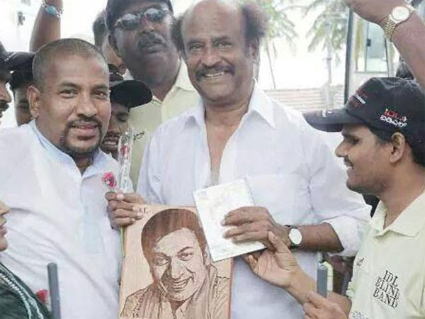 Rajnikanth Posing With Appaji's Pic