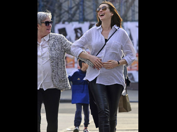 Anne Hathaway & Chrissy Teigen Show Off Their Baby Bumps Anne Hathaway & Chrissy Teigen Show Off Their Baby Bumps