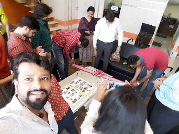 Team Unwrapping The Gift