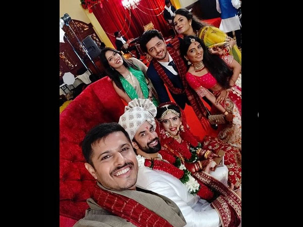 The Newlyweds Pose With Their Friends