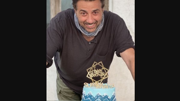 The Birthday Boy Poses With His Birthday Cake