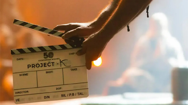 Young Rebel Star Prabhass upcoming pan -India film tentatively titled Project K, under the direction of national award winner Nag Ashwin is in news for its brand new plush office space in Mumbai. The entire team-including the veteran actor Amitabh Bachchan, several actors and directors were spotted lounging in the new pad that was inaugurated recently. A picture from the get-together was posted on Twitter and it has gone viral now. The picture has Amitabh Bachchan, Prabhas, KGF director Prashanth Neel, veteran director K Raghavendra Rao, actor Nani, Dulquer Salman and Nag Ashwin posing for a picture. The image is screaming positive vibes and is radiating joy. Project K is launched as a prestigious venture for Vyjayanthi Movies, marking the production houses 50th anniveersary. The movie is being made on a budget of whopping Rs 500 Crore and is a science fiction film. Project K will be shot in both Hindi and Telugu. The movie marks the Tollywood debut of Deepika Padukone and Bollywood debut of Nag Ashwin. The film also has Disha Patani in a key role. Project K is touted as the most expensive film that is being made in India. Mickey J Meyer, who is known for his soulful melody songs and background scores is roped in for the film as its musician. Dani Sanchez-Lopez, who worked with Nag Ashwin for Mahanati, was signed as Project Ks Cinematographer. The movie will hit the screens in the year 2023. Another interesting factor of the film is that when the director opted for a real-looking or wanted to make authentic futuristic vehicles for the film, he approached Anand Mahindra of Mahindra & Mahindra to assist with the production of such vehicles to which Mahindra agreed. A set depicting the future time period has been erected at Ramoji Film City in Hyderabad where a number of scenes have been shot already. 