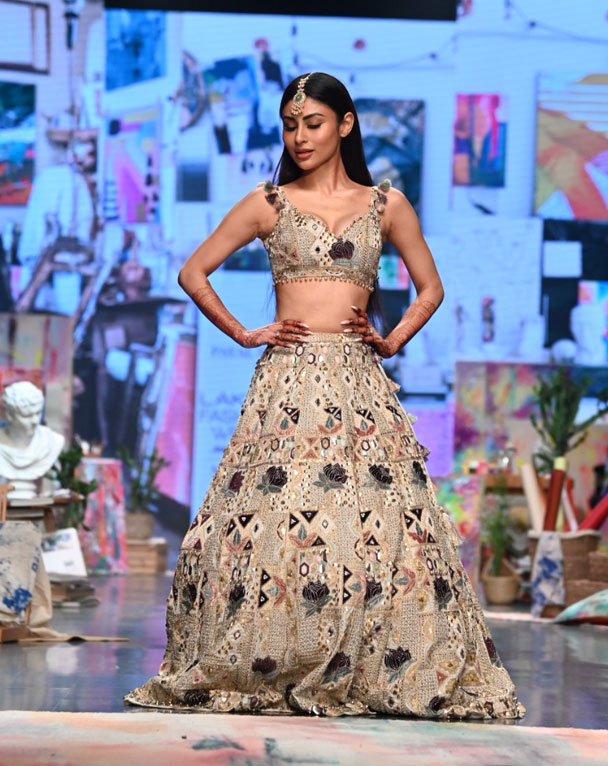 Mouni in cream lehenga