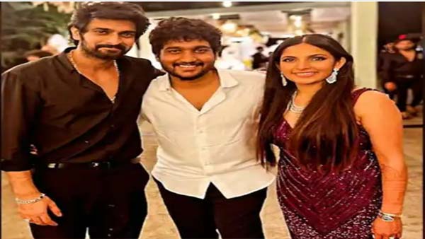 The couple Pose With A Friend At One Of Their Wedding Celebrations