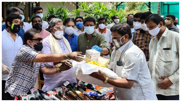 Zameer ahmed and siddaramaiah distributed Food Kit to Film industry workers.