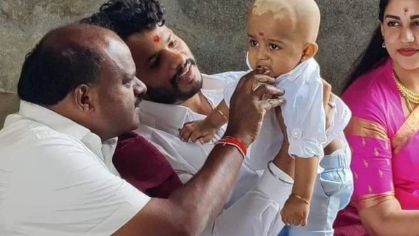 Nikhil Kumaraswamy Offeres Son Avyan mudi at Hassan Temple