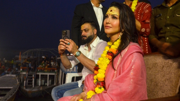 Actress Sunny Leone attends Ganga Aarti with Abhishek Singh in Varanasi Actress Sunny Leone attends Ganga Aarti with Abhishek Singh in Varanasi
