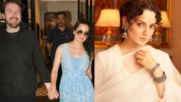 Actress Kangana Ranaut smiles as she holds hands with a foreigner