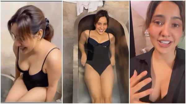 neha-sharma-takes-an-ice-bath-in-a-black-swim-suit