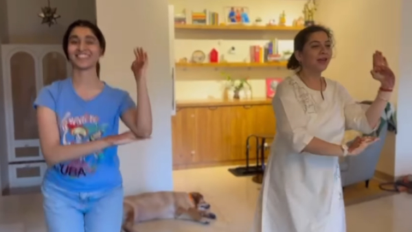 Sudharani and her daughter dance to the Anand film song for Shivarajkumar s return from the USA