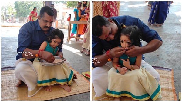 അച്ഛന് അനില് കുമാറിന്റെ മടിയിലിരുന്ന്