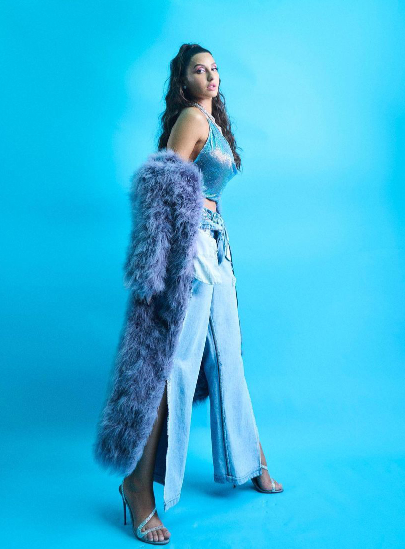 Nora Fatehi Redefines Fashion Goals in Shimmering Blue Top and Denim Pants