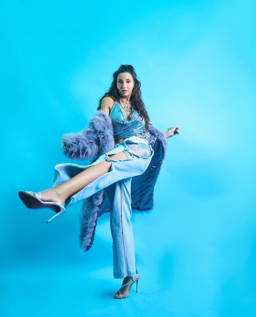 Nora Fatehi Redefines Fashion Goals in Shimmering Blue Top and Denim Pants