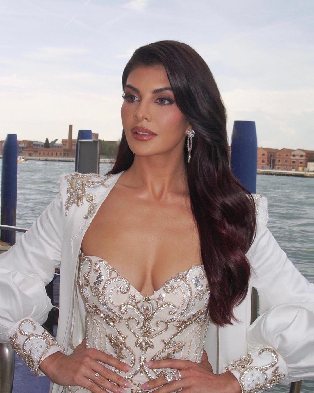 Jacqueline Fernandez Radiates Elegance in a Mini Dress at Venice's Ferrari Red Carpet Event