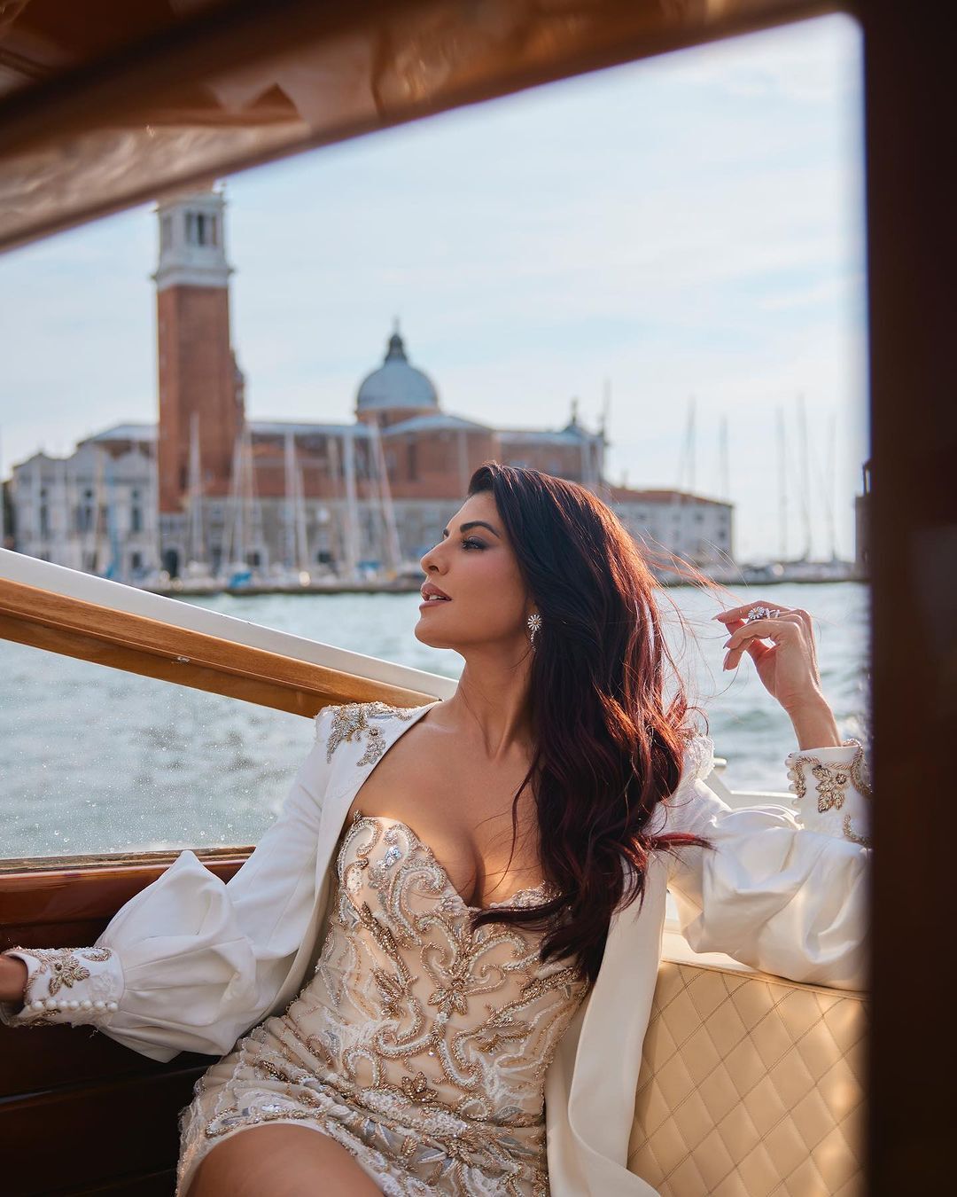 Jacqueline Fernandez Radiates Elegance in a Mini Dress at Venice's Ferrari Red Carpet Event