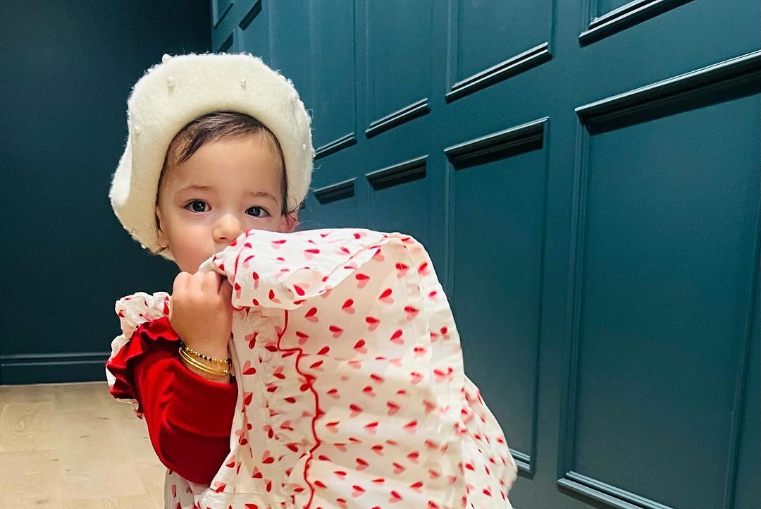 Malti in an adorable white and red outfit