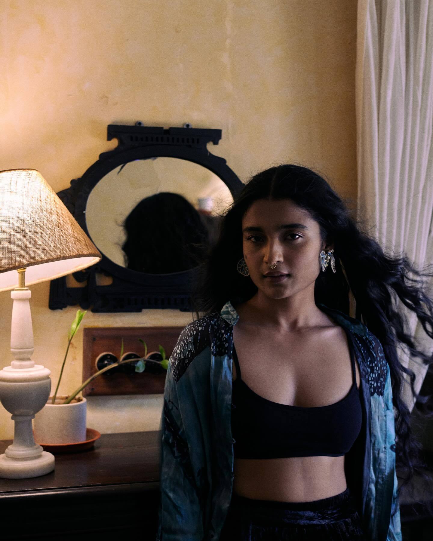 Chaitra J Achar is adorned in black thigh-high slit pants