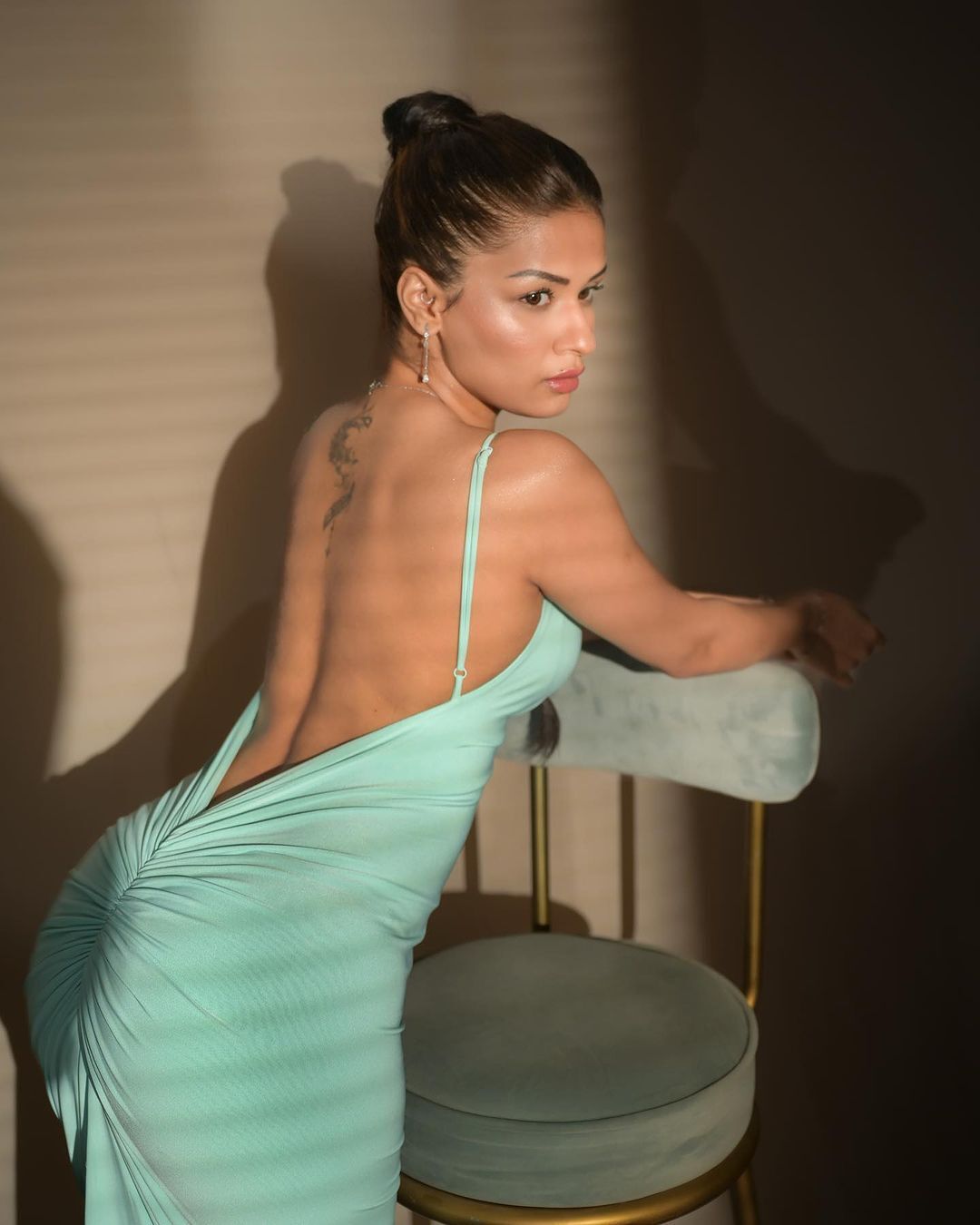 Avneet Kaur dazzles in her captivating sky-blue backless ensemble.