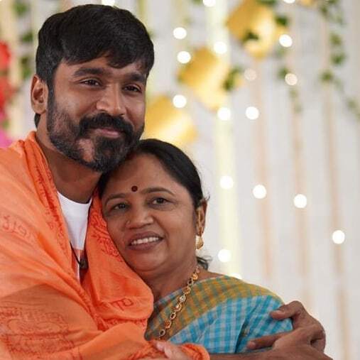 Dhanush embraces his mother, Vijaylakshmi, in a heartfelt hug as they pause for a photo, radiating w