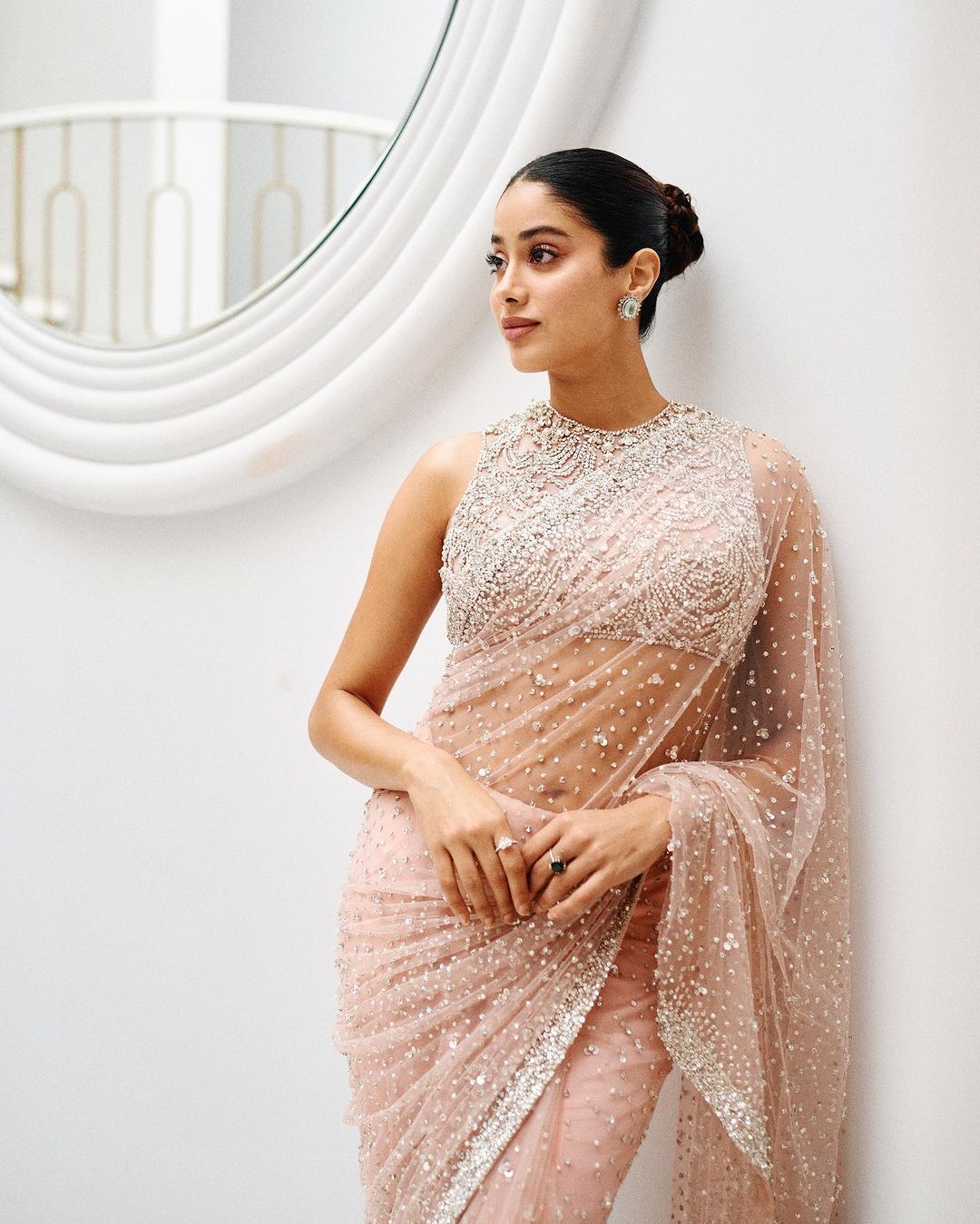Janhvi Kapoor  in a peach net saree adorned with pearls