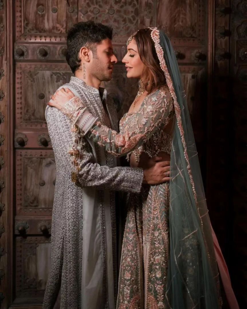 Surbhi Chandna bridal look in baby pink dupatta with a long trail.