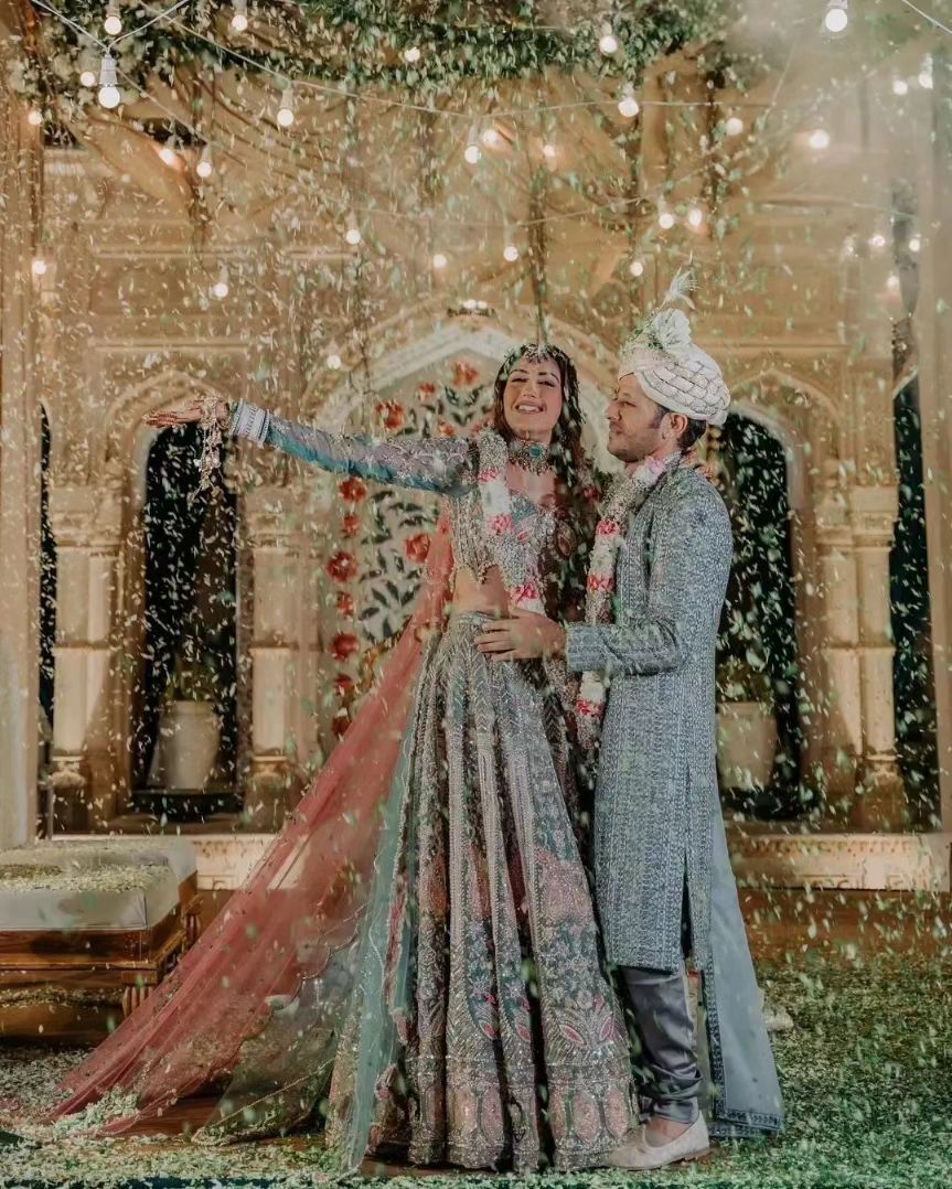 Surbhi chose to wear a silver lehenga adorned with several pink embelishment's