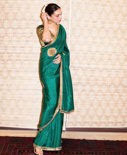 Aditi opted for golden Kolhapuri sandals.