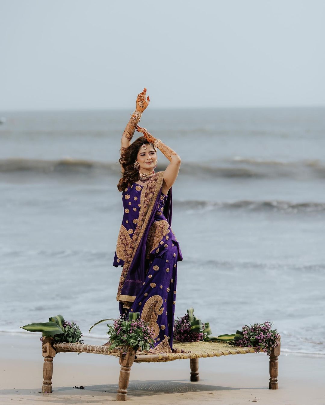 Arti posing on the sandy shores, living her dreams under the limitless sky.