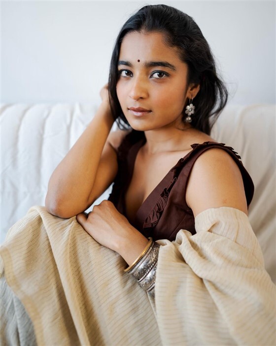 Chaithra Achar looks stunning and gorgeous in saree and deep neck blouse