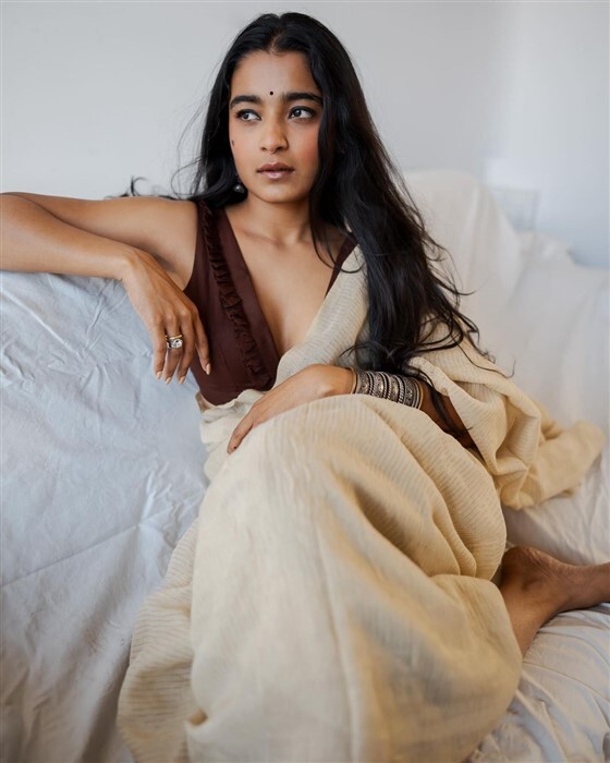 Chaithra Achar looks stunning and gorgeous in saree and deep neck blouse