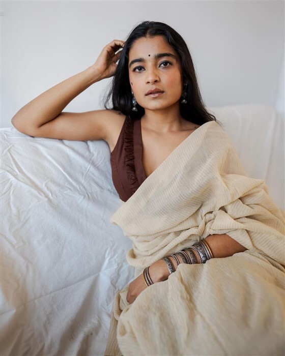 Chaithra Achar looks stunning and gorgeous in saree and deep neck blouse
