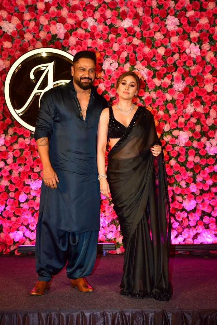 Shefali Jariwala with her husband at Arti Singh and Dipak Chauhan's sangeet ceremony in Mumbai.