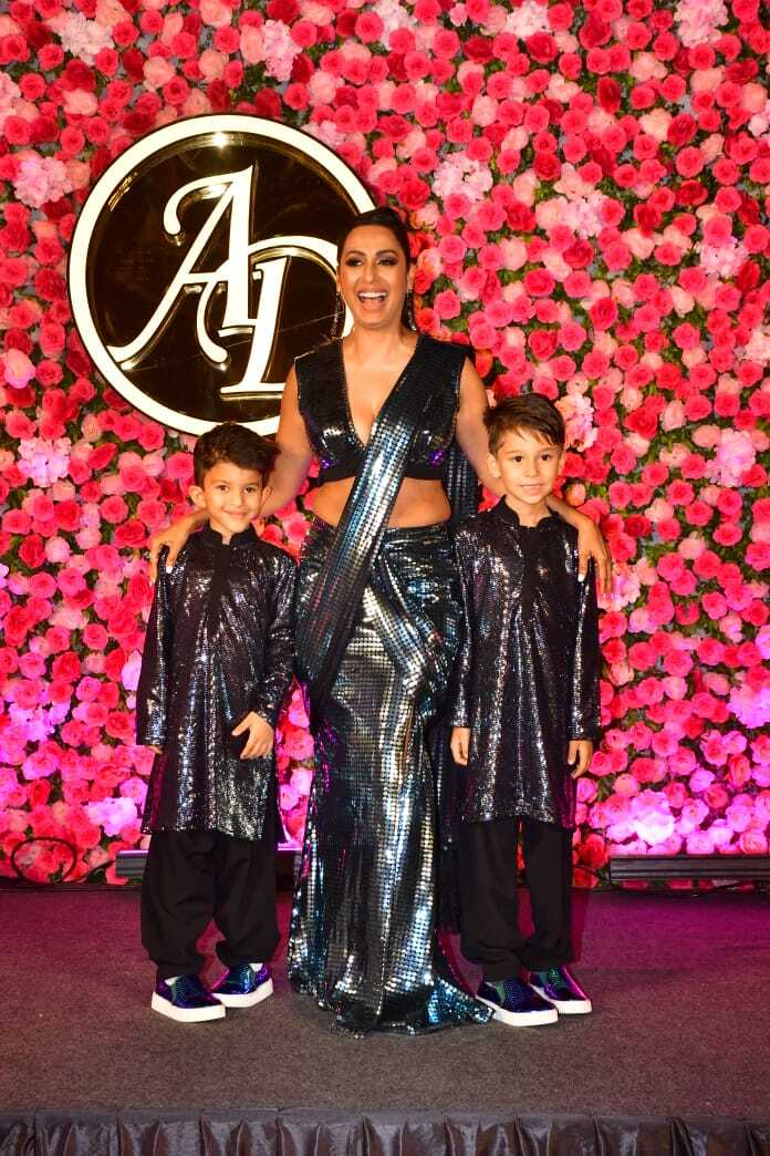 Karishma Shah and Arti Singh's Bhabhi dazzled at the red carpet in a mettalic saree with her boys.