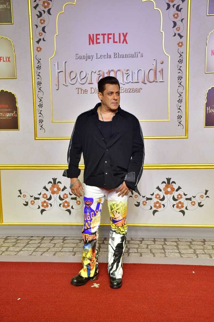 Salman Khan's Quirky Look, White Pants with Anime Designs and Classic Black Shirt