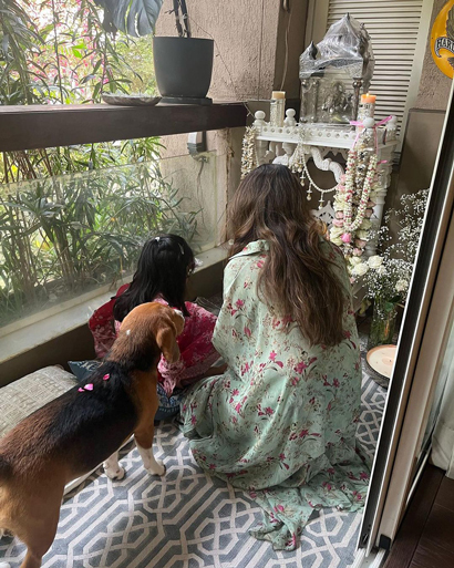 Varun's wife Natasha Dalal was seen offering prayers at their home temple alongside their dog.