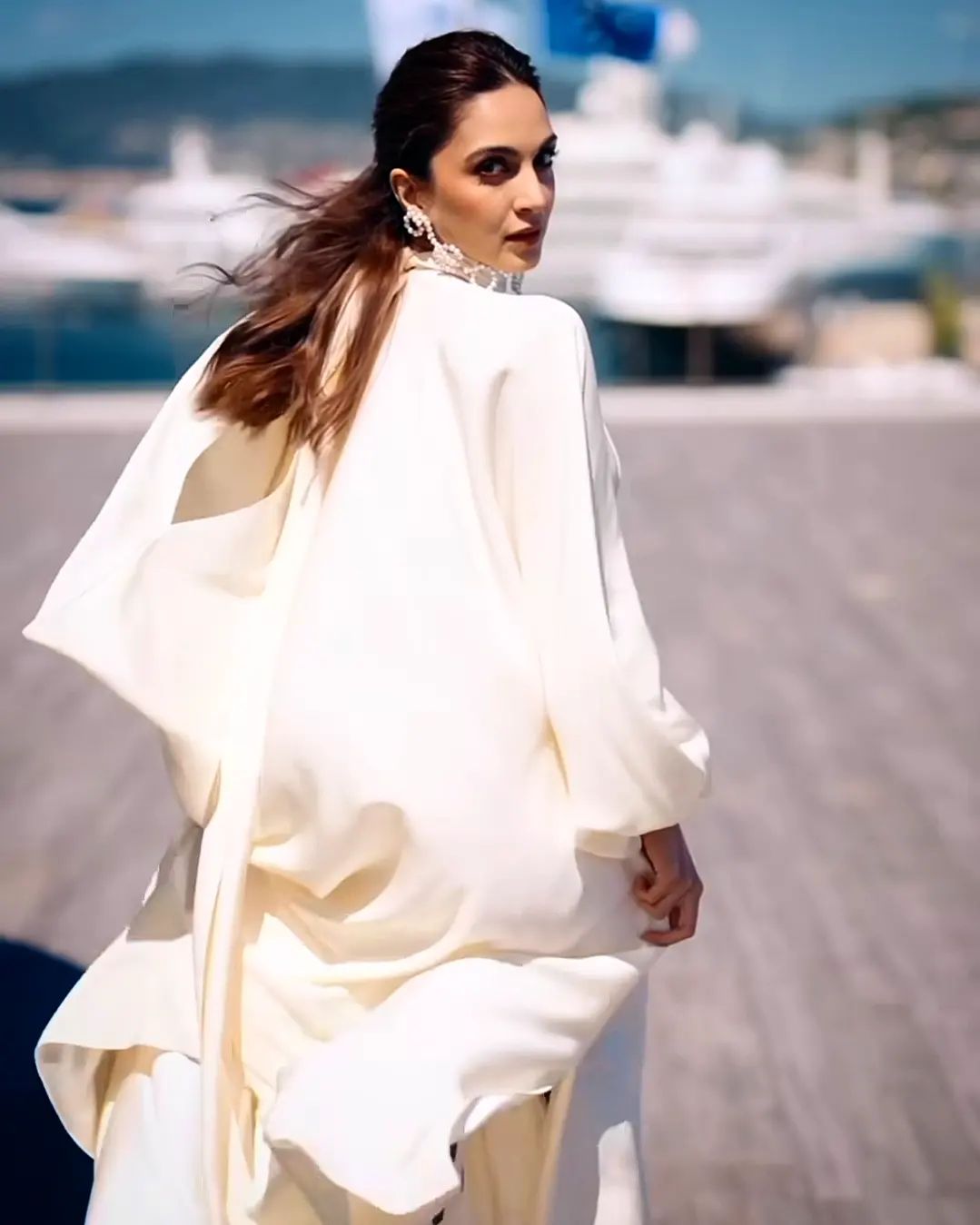 Kiara Turns Heads in Sultry White Gown with Plunging Neckline and Thigh-High Slit