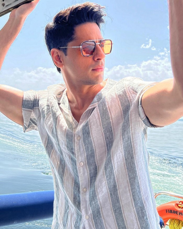 Classic meets contemporary as Sidharth sports a timeless cotton shirt in blue and white stripes