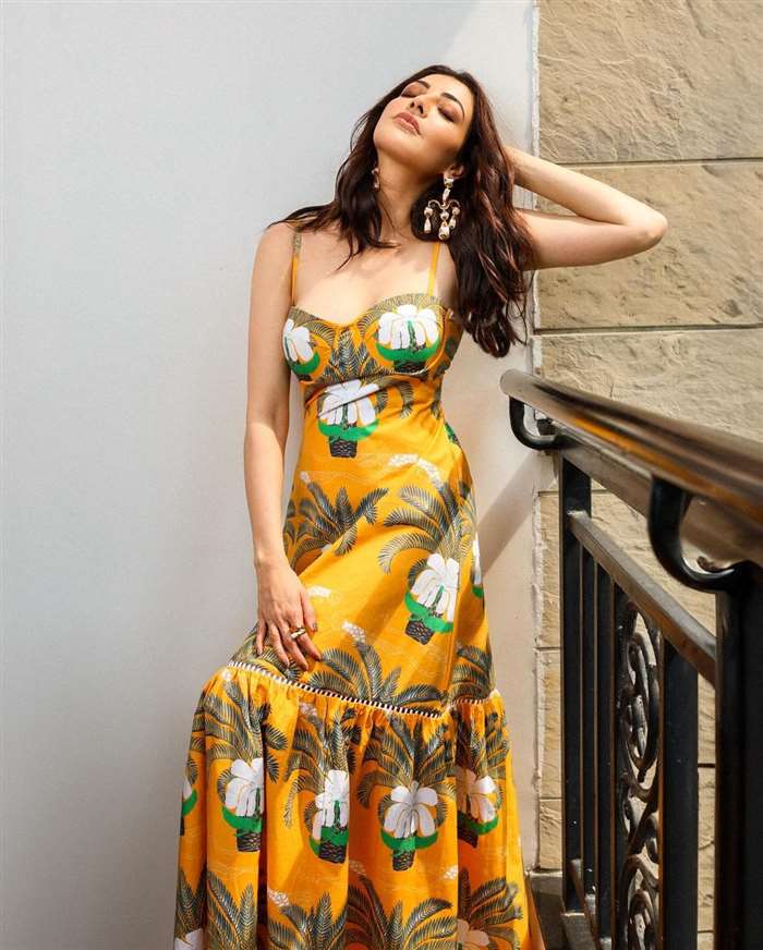 The beautiful printed yellow dress featured intricate embroidery at the hemline