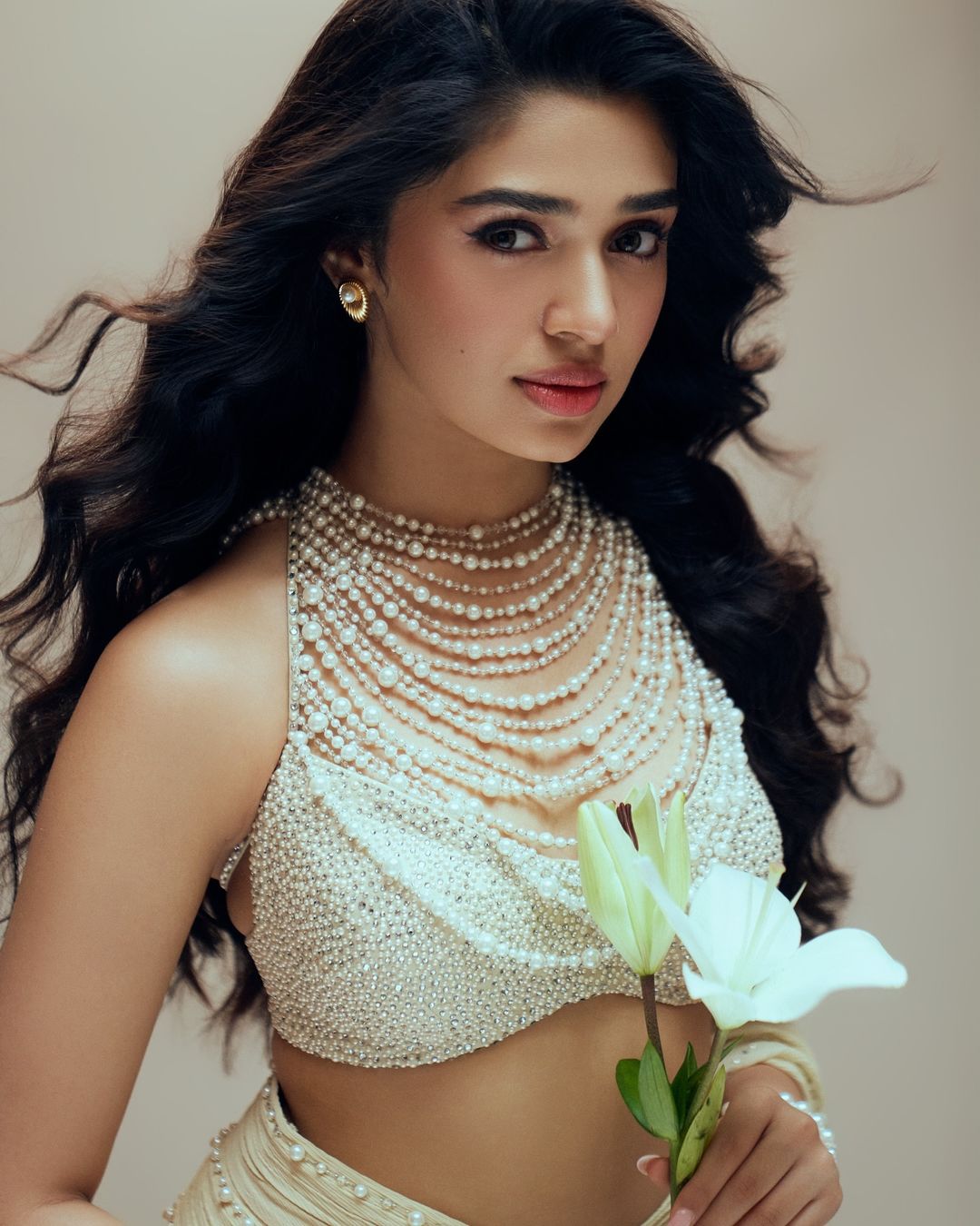 Krithi Shetty stuns in a pearl-adorned saree