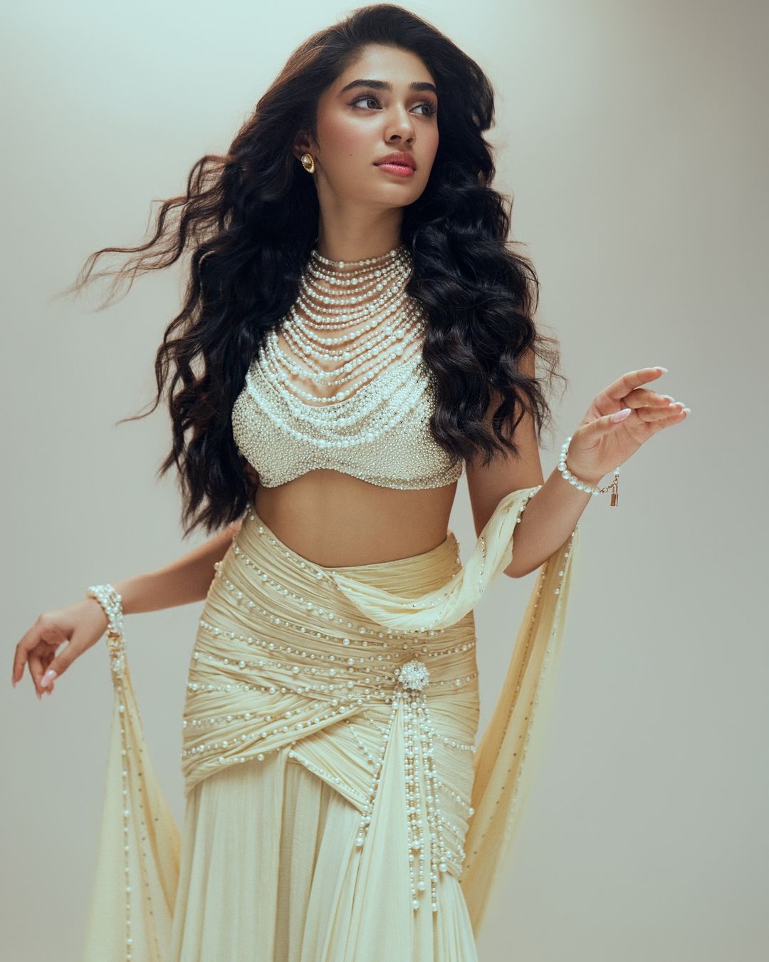 Krithi Shetty captivates in a Tarun Tahiliani saree, adorned with pearls